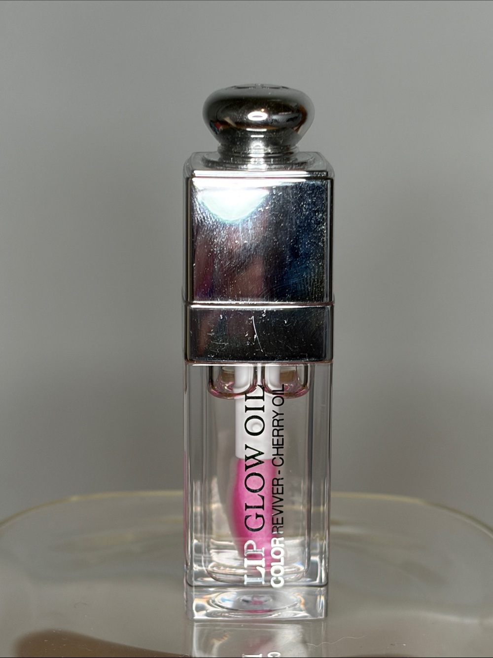 Clear Glass Cloche with Silver-Topped Lip Gloss Display